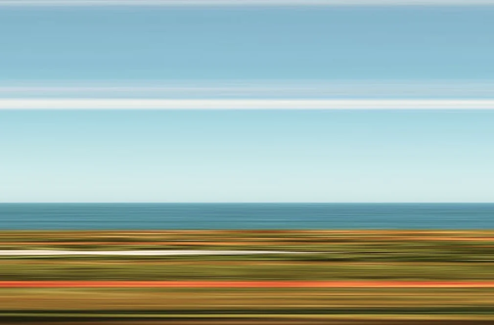 An eye-catching aerial landscape of green coastal hills.